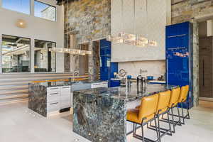 Bar area with a high ceiling and a sink