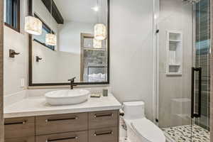 Full bath featuring vanity and a stall shower
