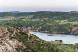 View of mountain backdrop featuring a large body of water