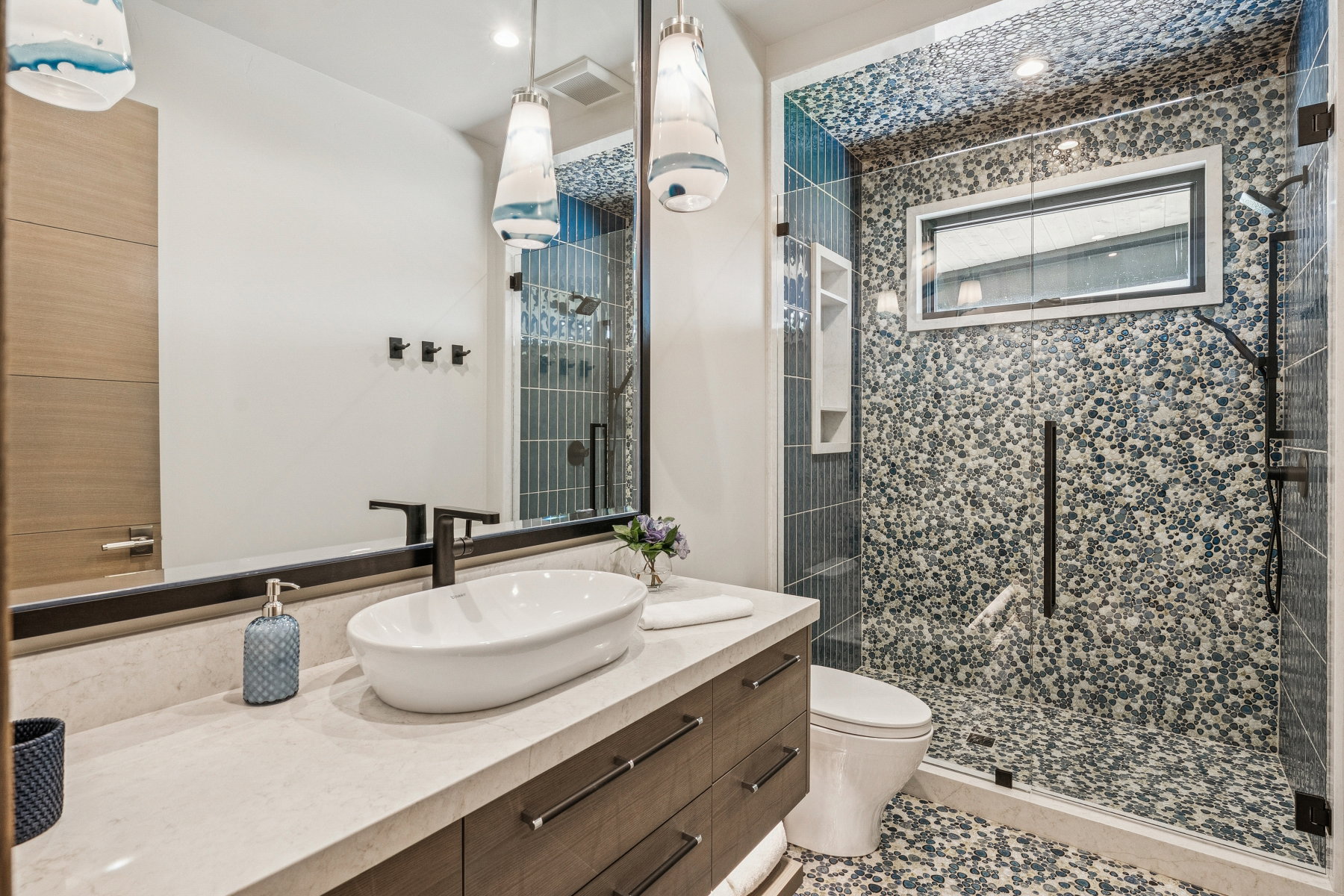 Bathroom featuring vanity and a stall shower
