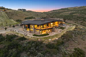 Back of property featuring a patio area, a standing seam roof, a metal roof, and a mountain view