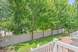 Fenced backyard with a patio