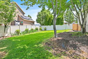 View of fenced backyard