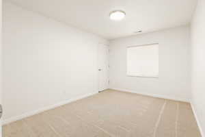 Unfurnished room with carpet flooring