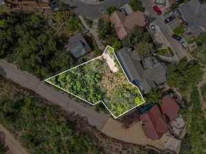 Aerial view of residential area featuring property boundaries highlighted