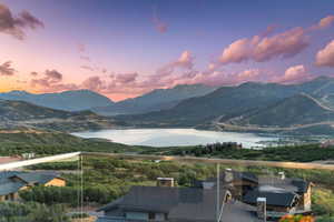 View of mountain backdrop featuring a large body of water