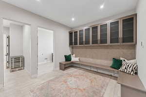 Mudroom featuring recessed lighting and light wood-style floors
