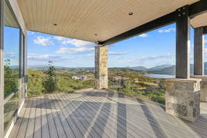 Wooden terrace with a water and mountain view