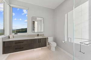 Bathroom featuring vanity and a shower stall