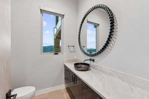 Bathroom featuring vanity and wood finished floors