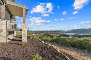 View of yard with a water and mountain view