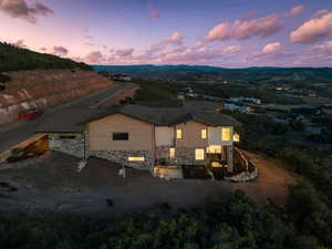 View of subject property featuring a mountainous background