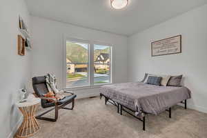 Carpeted bedroom featuring baseboards