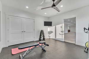 Exercise area with ceiling fan and recessed lighting