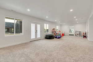 Game room with french doors, carpet floors, and recessed lighting