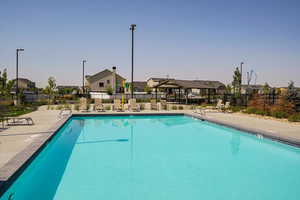 Community pool featuring a residential view and a patio