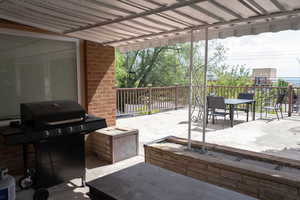 View of patio / terrace featuring a grill and outdoor dining area