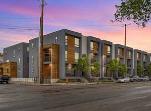 View of property at dusk
