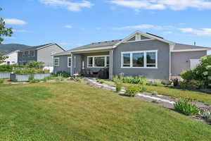 Rear view of house featuring stucco siding