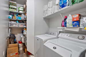 Washroom featuring independent washer and dryer