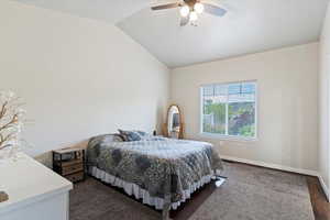 Bedroom with vaulted ceiling and ceiling fan