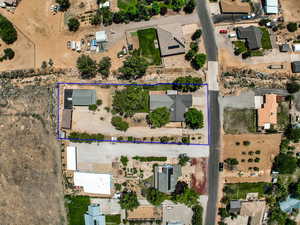 Aerial view of property and surrounding area with property boundaries highlighted