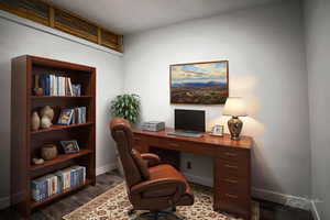 Office featuring dark wood finished floors and baseboards