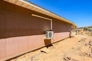 View of home's exterior with an ac unit