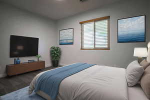 Bedroom featuring carpet floors and baseboards