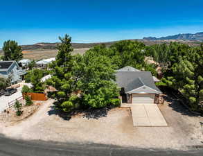 Aerial view of property and surrounding area with mountains