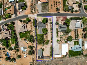 Aerial view of residential area with property boundaries highlighted