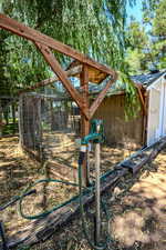 View of yard featuring an outbuilding and exterior structure