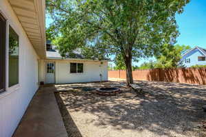 View of yard with an outdoor fire pit