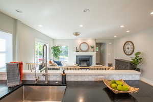 Living room featuring a fireplace and recessed lighting