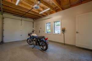 Garage featuring a garage door opener