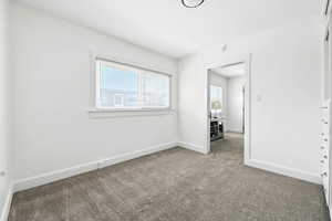 Unfurnished bedroom with carpet floors