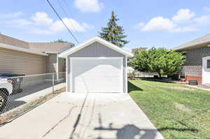 Detached garage featuring driveway
