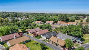 Aerial overview of property's location featuring nearby suburban area