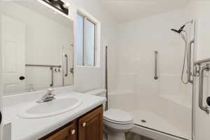 Bathroom with a walk in shower and vanity