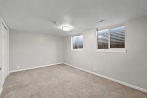 Unfurnished bedroom with carpet floors and a closet