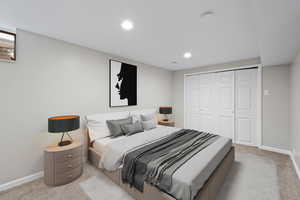 Carpeted bedroom with a closet and recessed lighting