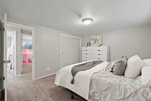 Bedroom with carpet flooring and a closet
