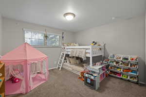 Carpeted bedroom with baseboards