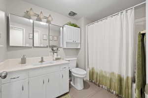 Full bath with vanity and shower / bath combination with curtain