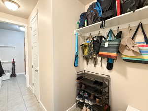 Mudroom featuring a textured ceiling and tile patterned flooring