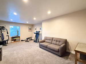 Exercise area with recessed lighting and carpet floors