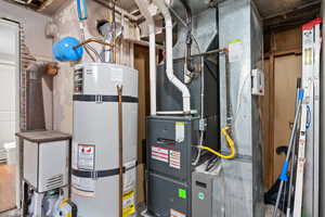 Utility room with updated water heater and heating unit