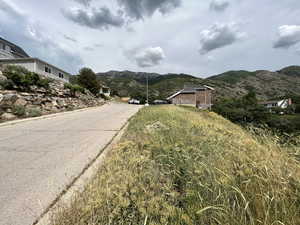 View of asphalt street with a mountain view