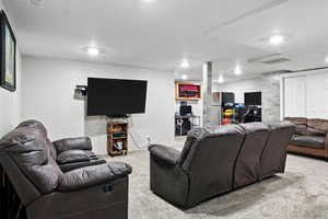 Living room featuring carpet flooring and recessed lighting