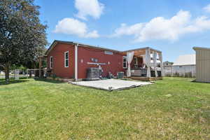 Rear view of house with a patio area and a wooden deck